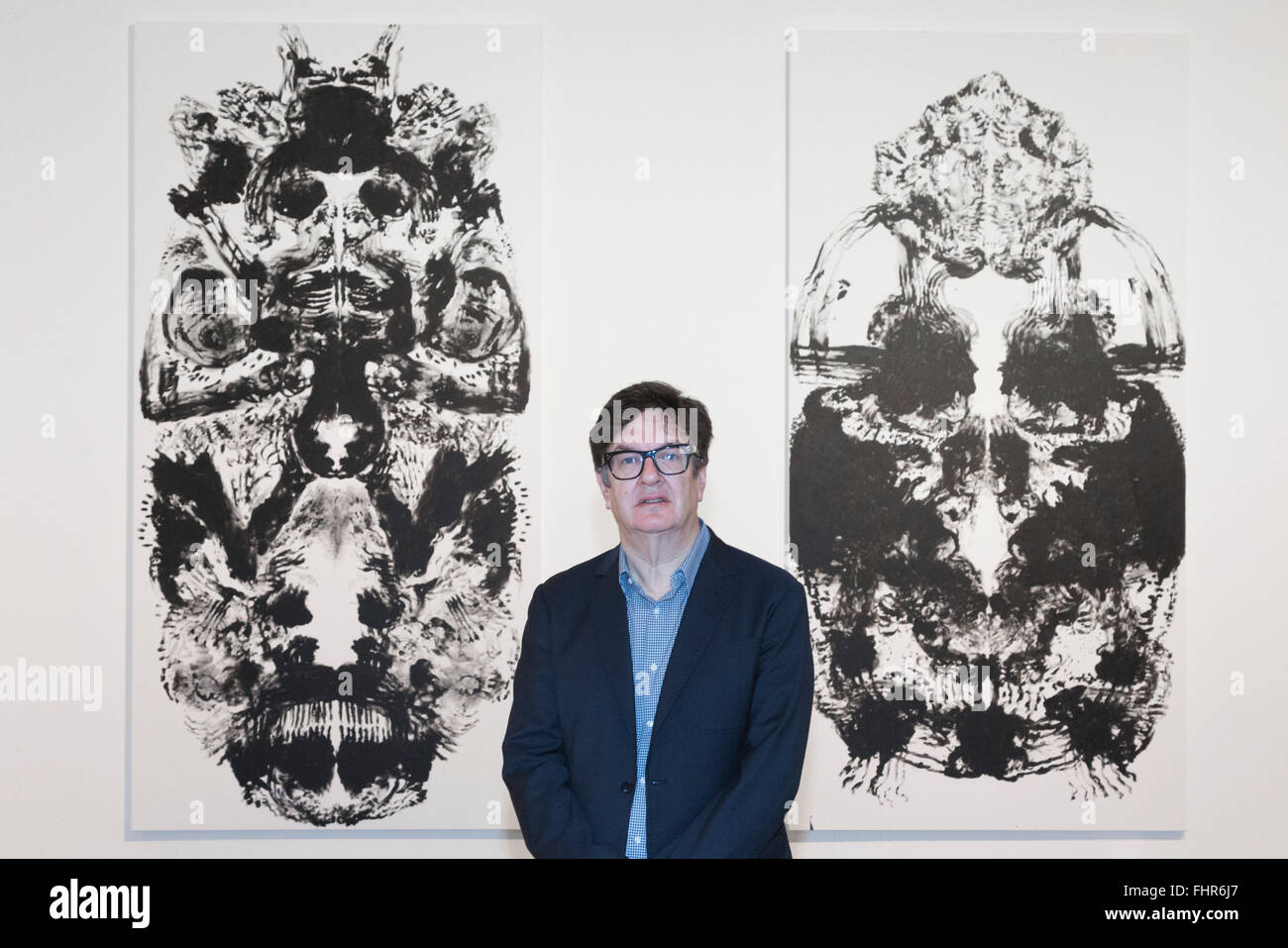 London, UK. 25 February 2016. Artist Mark Wallinger poses in front of his ID paintings. Hauser & Wirth gallery open a solo exhibition of new paintings and multi-media works by British artist Mark Wallinger. The exhibition, which takes up both spaces at Savile Row, runs from 26 February to 7 May 2016. Stock Photo