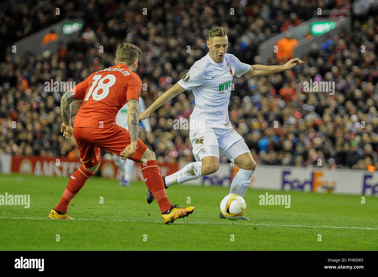 Liverpool, UK. 25th February, 2016. Europa League, knockout tie,for editorial use only   left Alberto Moreno (Liverpool FC) 18 and Dominik Kohr ( FC Augsburg ) 21  Credit:   Burghard Schreyer/Alamy Live News Stock Photo