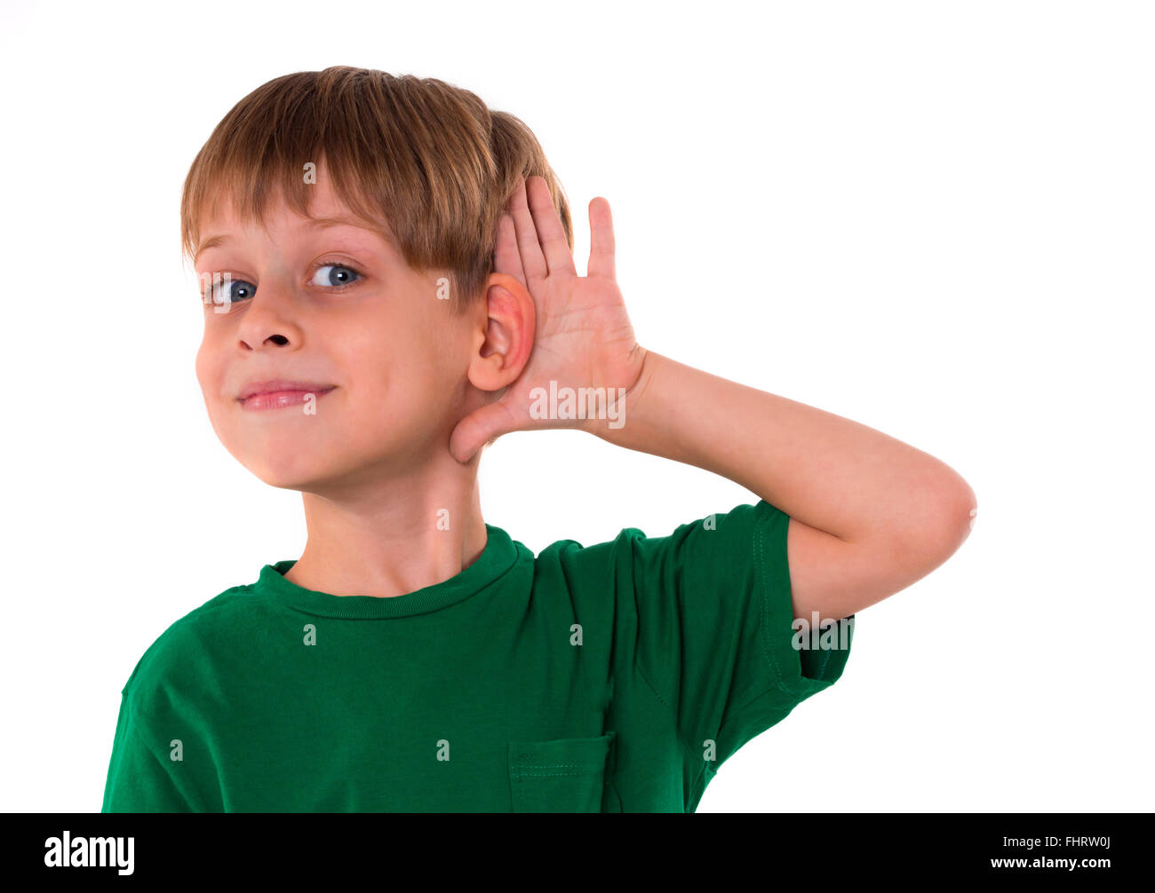 boy wanting to hear something Stock Photo
