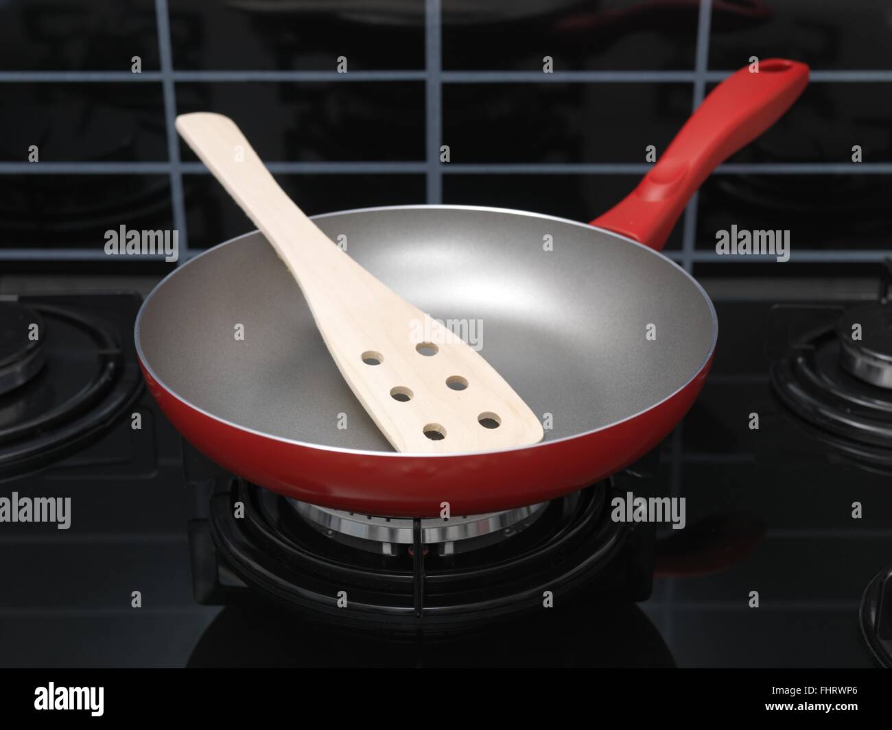 A frying pan on a stove top Stock Photo Alamy