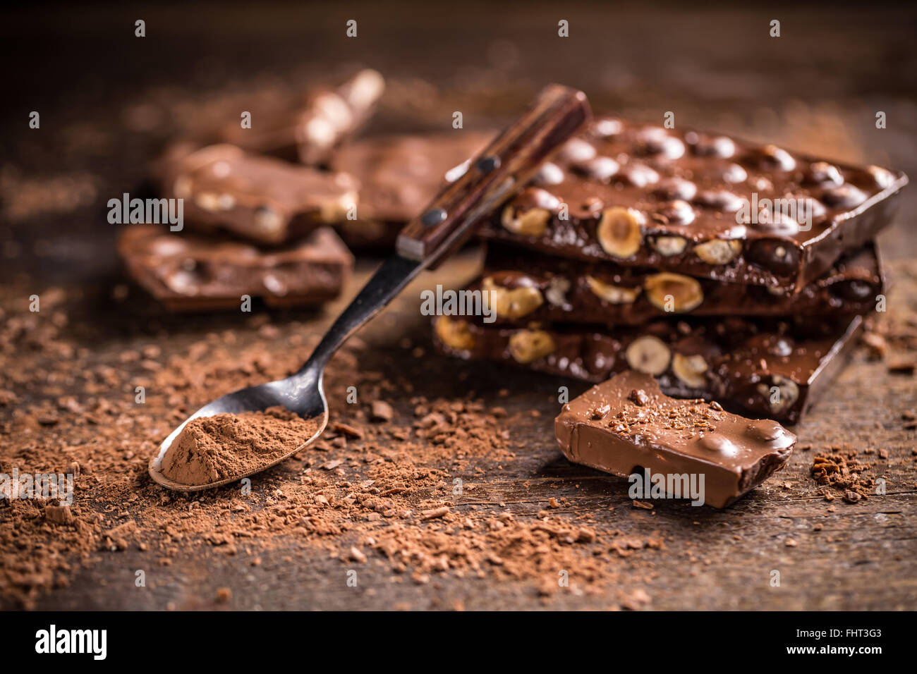 Chocolate with nuts on wooden background Stock Photo