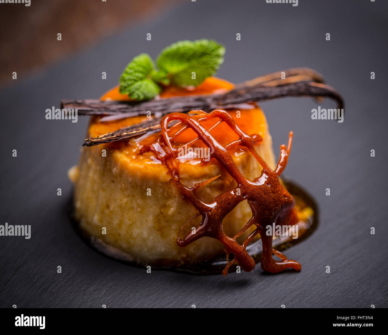 Delicious creme caramel dessert on black Stock Photo - Alamy