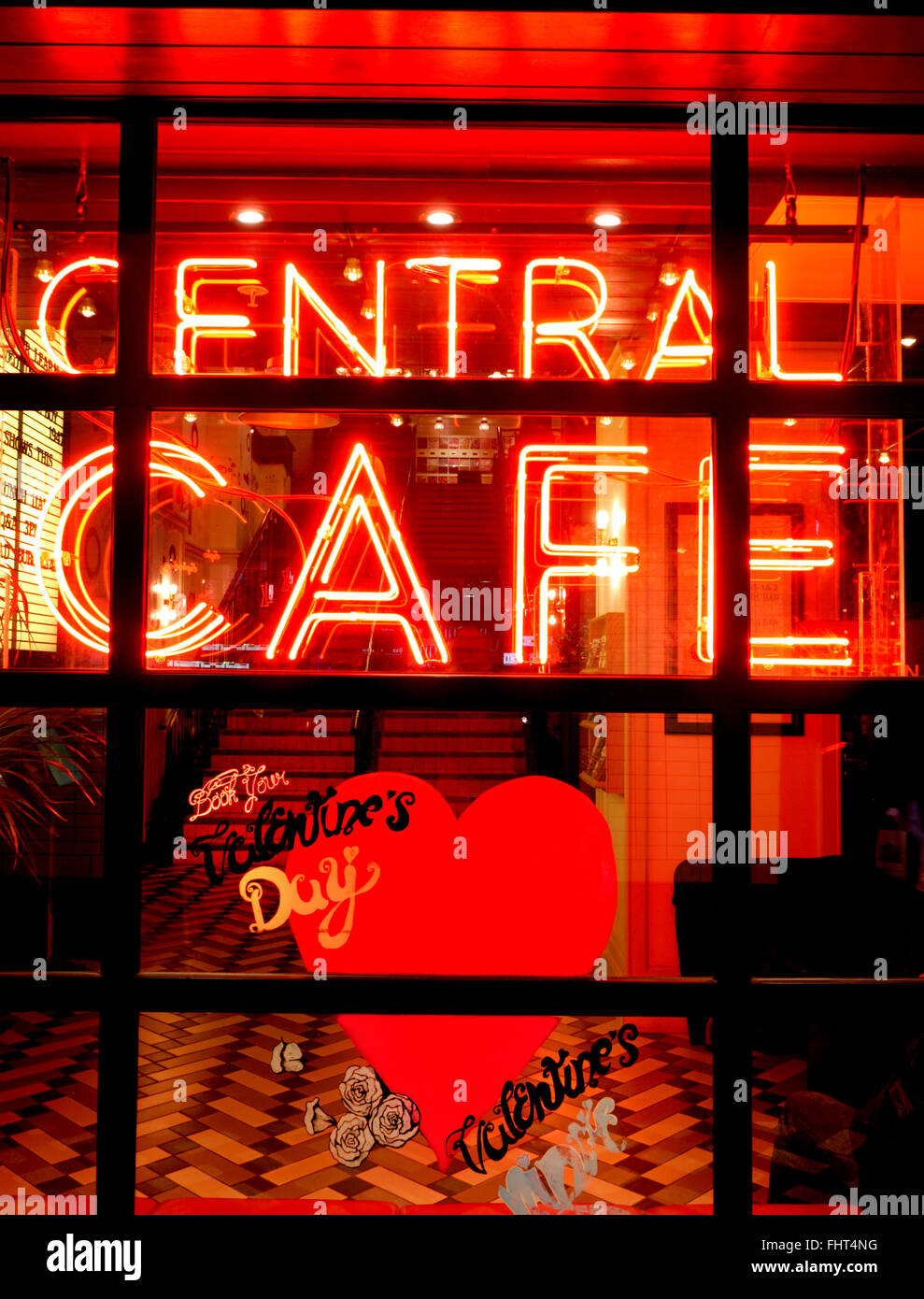 Warehouse style Central Cafe neon lit at night with Valentines Day special promotion Shaftesbury Avenue London UK Stock Photo