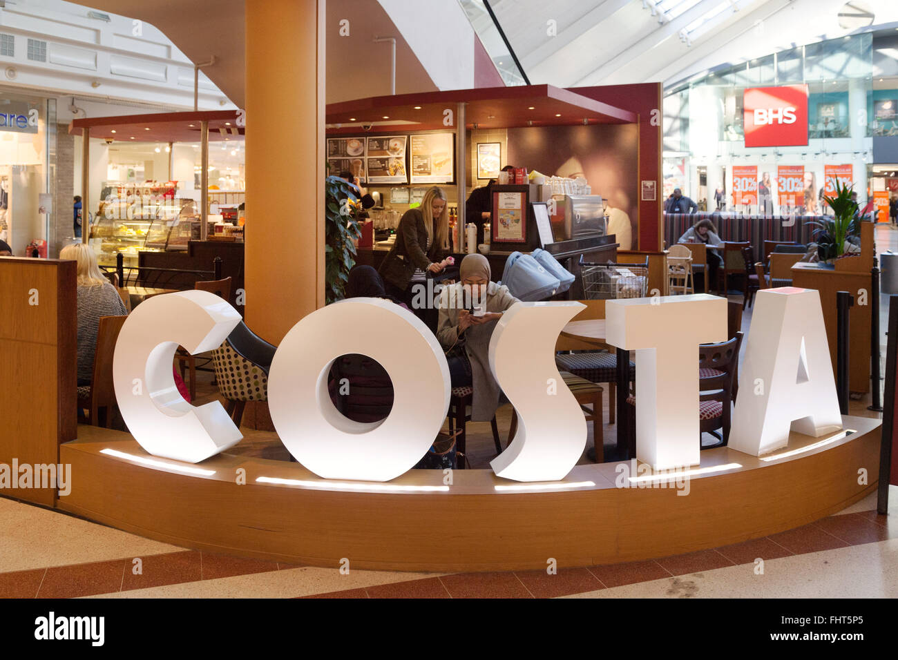 People drinking at the Costa Coffee bar, the Grafton Centre, Cambridge UK Stock Photo