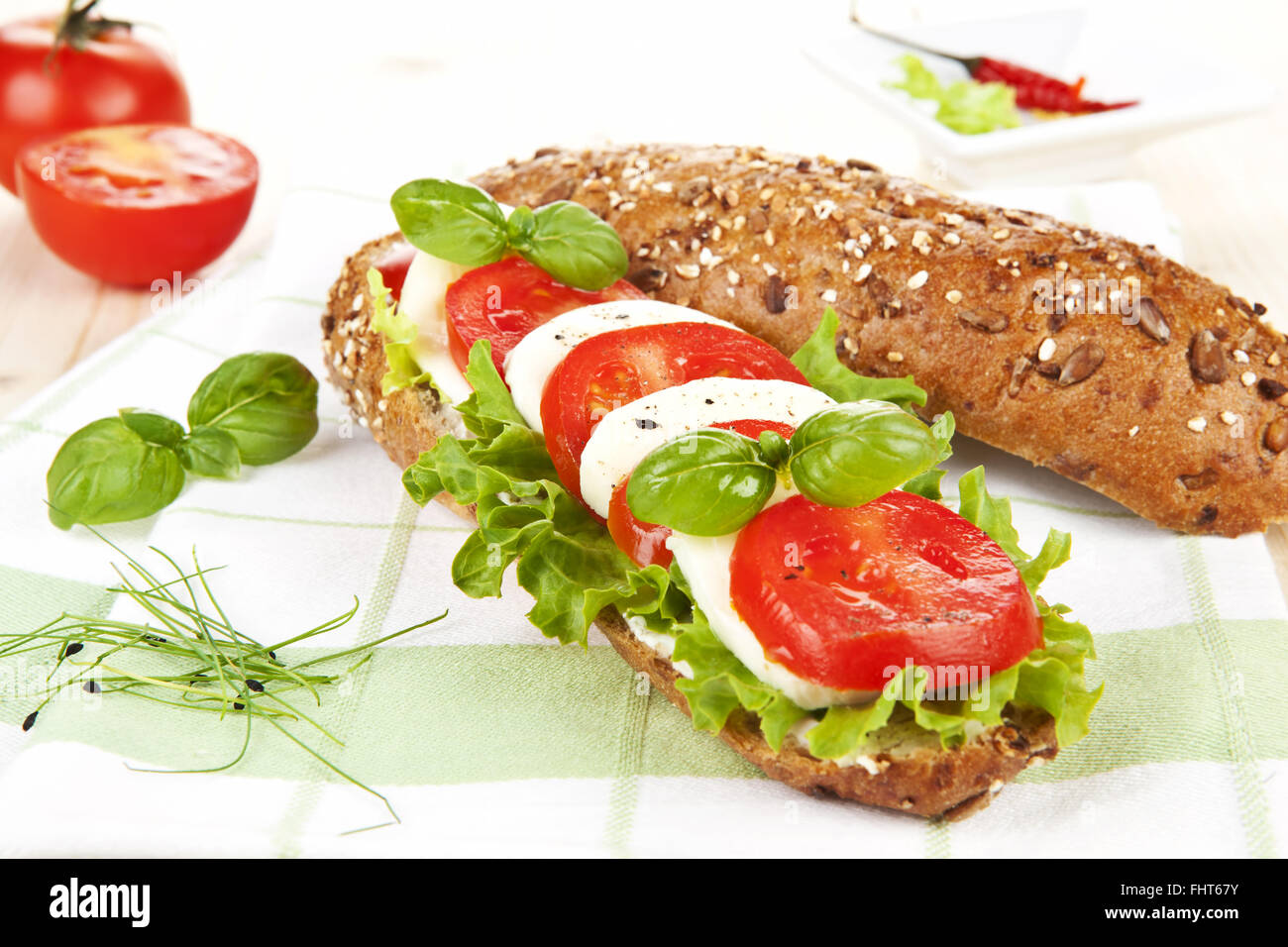 Baguette with tomato and mozzarella Stock Photo Alamy
