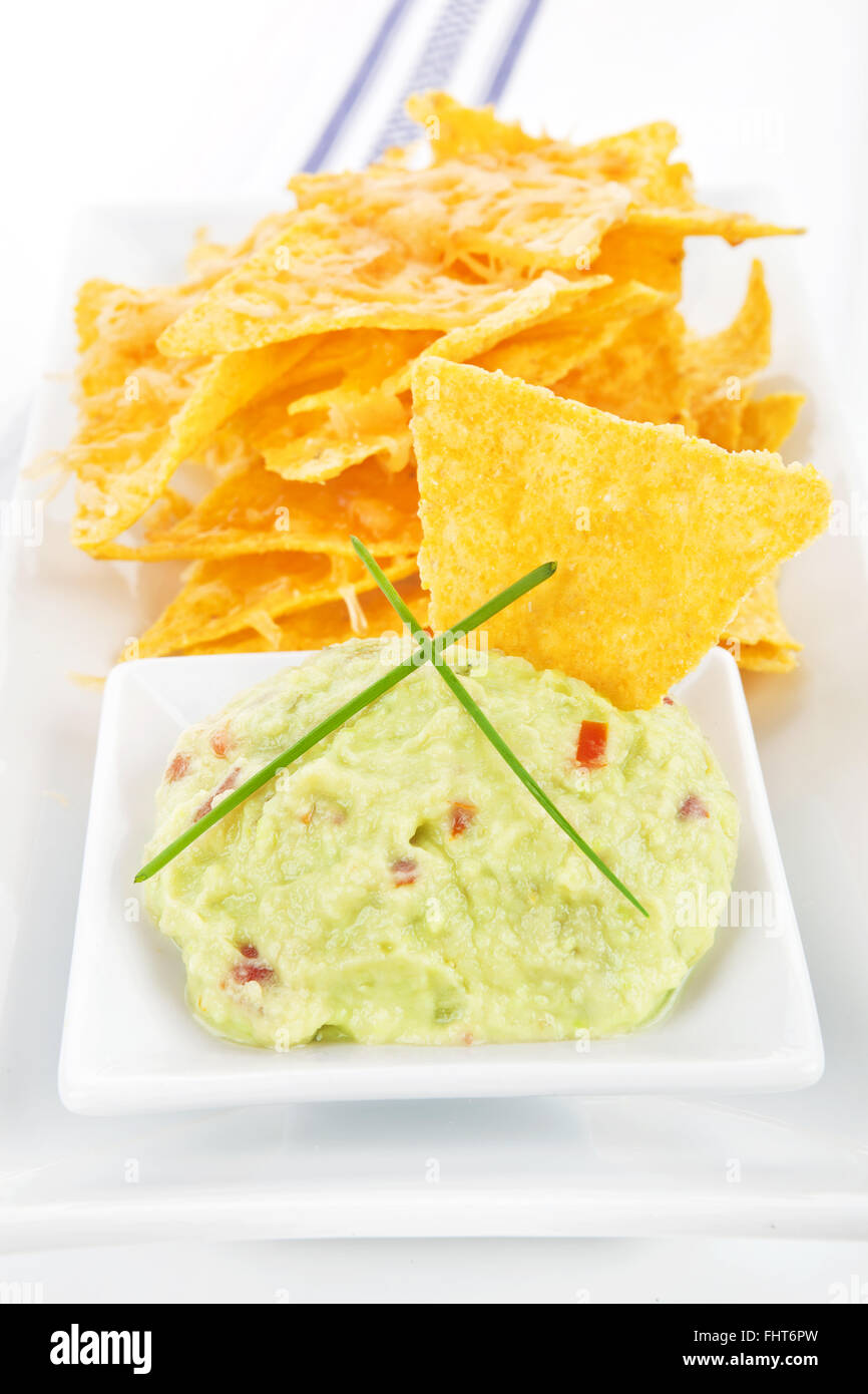 Nachos with guacamole dip Stock Photo Alamy