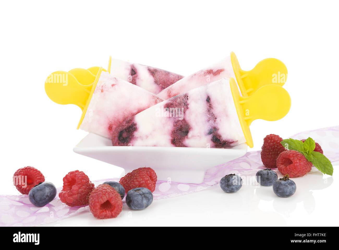 Fruit ice lolly with fresh fruit isolated. Stock Photo
