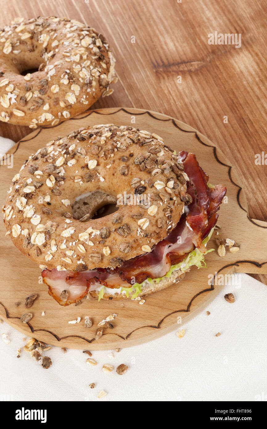 Whole grain bagel with bacon Stock Photo