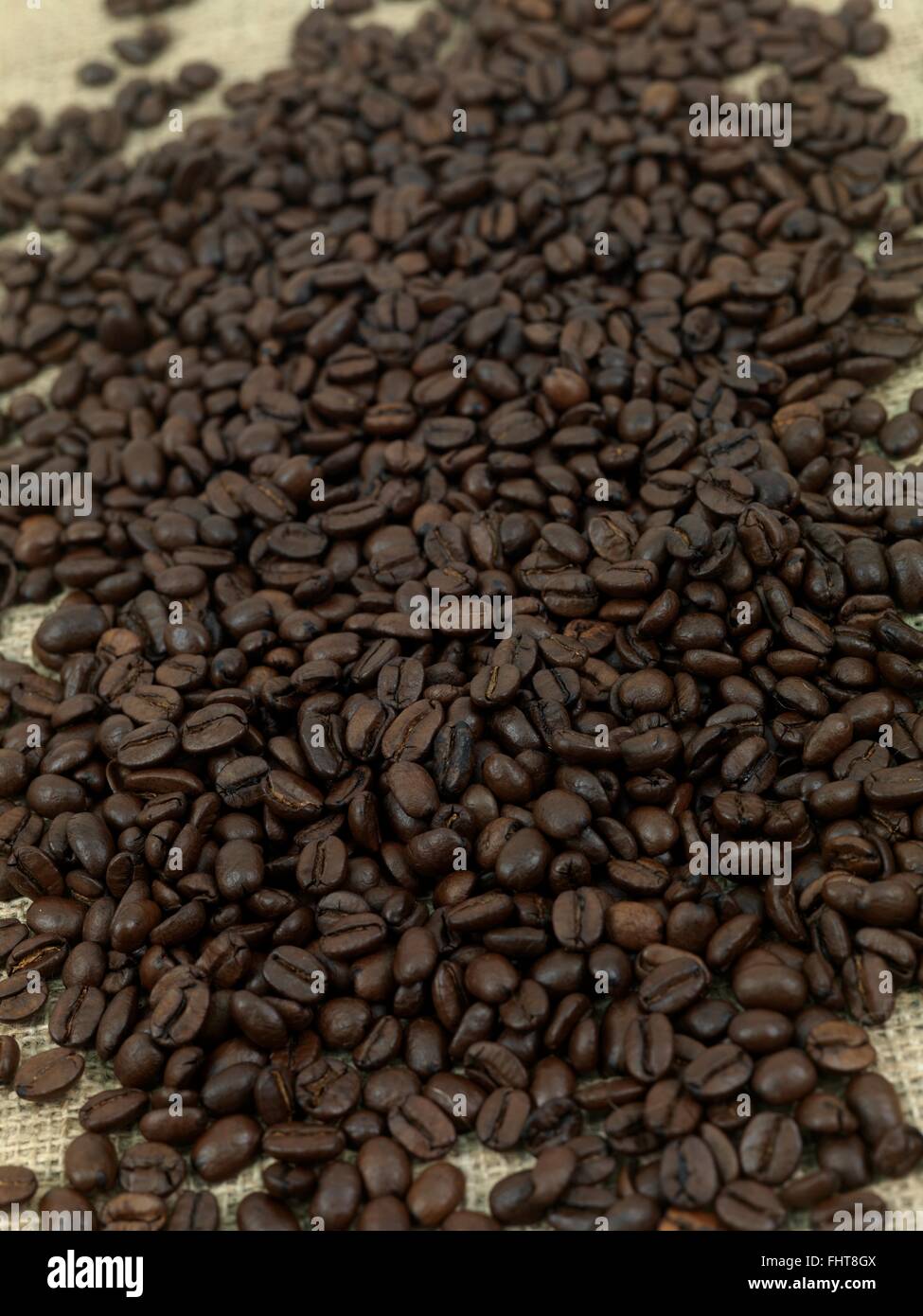 Roasted coffee beans on a jute sack hi-res stock photography and images ...