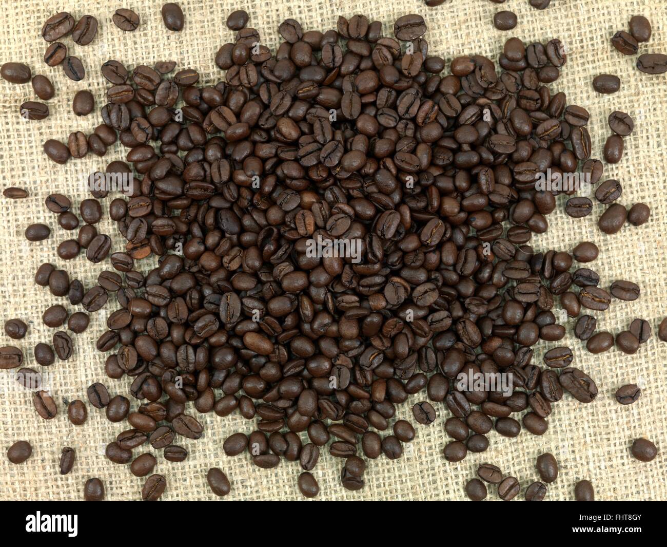 Roasted coffee beans on a jute sack hi-res stock photography and images ...