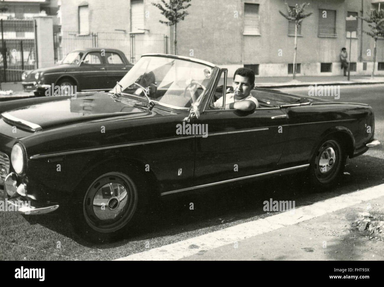 A man driving a 1200 Fiat Spider Pininfarina, Italy Stock Photo