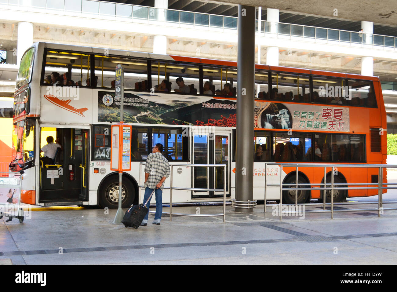 Hong Kong airport bus stop for departures. Hong Kong airport is one of the busiest airports in the world Stock Photo