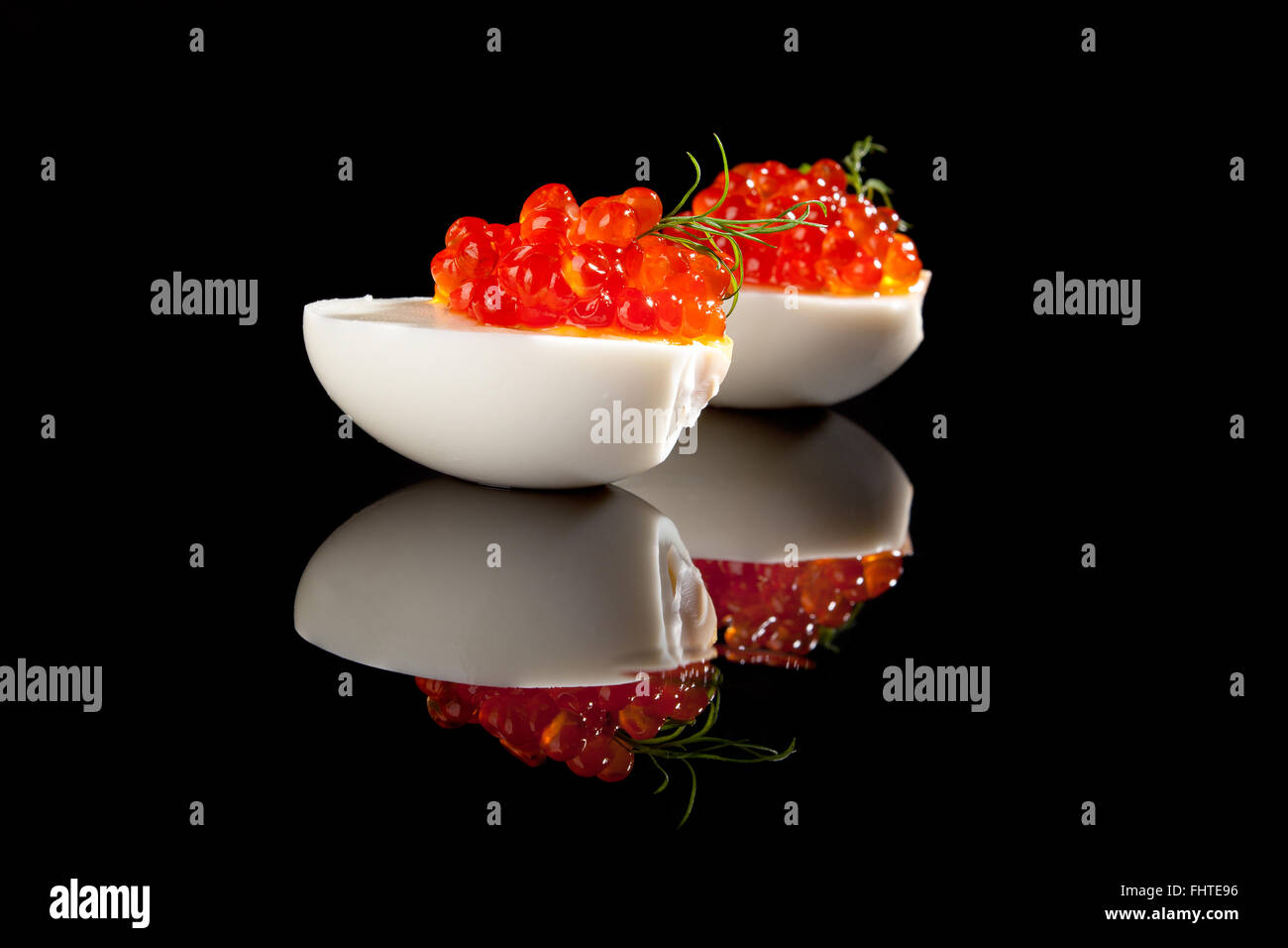 Luxury food. Caviar in eggs with dill Stock Photo Alamy