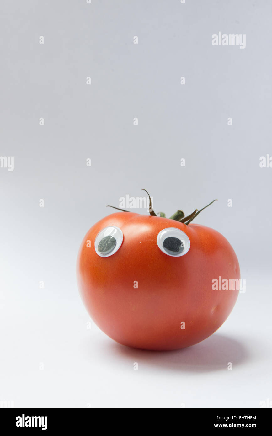 A tomato with googly eyes Stock Photo Alamy