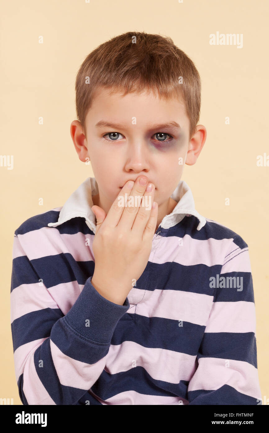 Domestic violence. Psst, don't tell anyone. Stock Photo