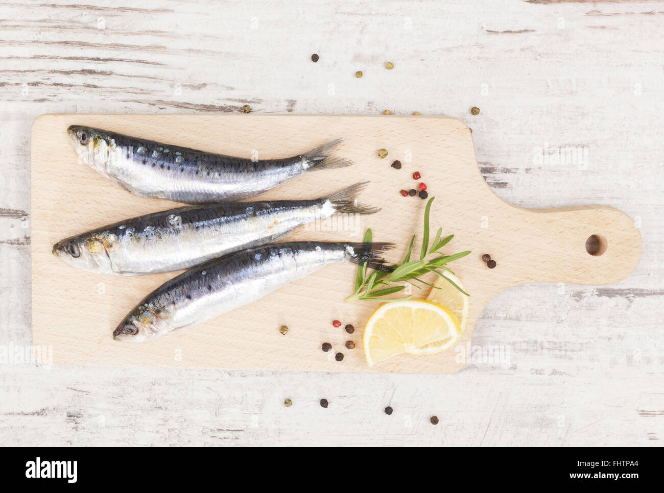 Delicious anchovies fish eating Stock Photo Alamy