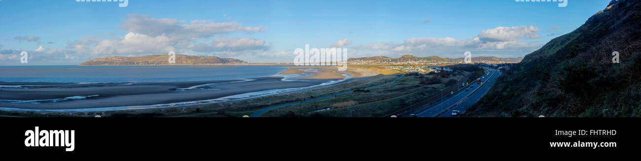 Panorama showing the Great Orme across to the A55 North Wales Coast Road passing by Conwy. Stock Photo