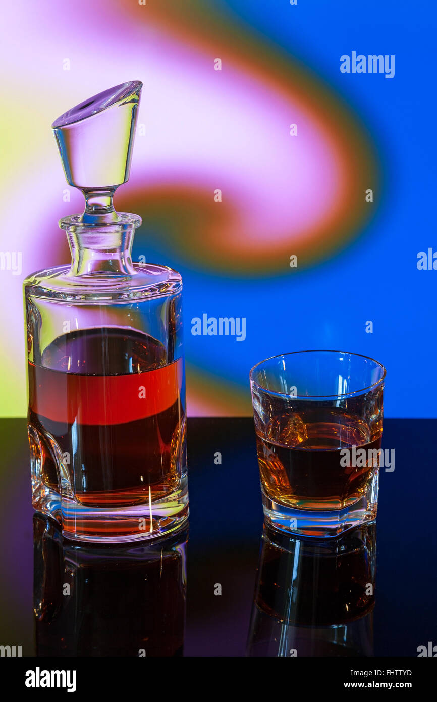 whiskey bottle on abstract background Stock Photo - Alamy