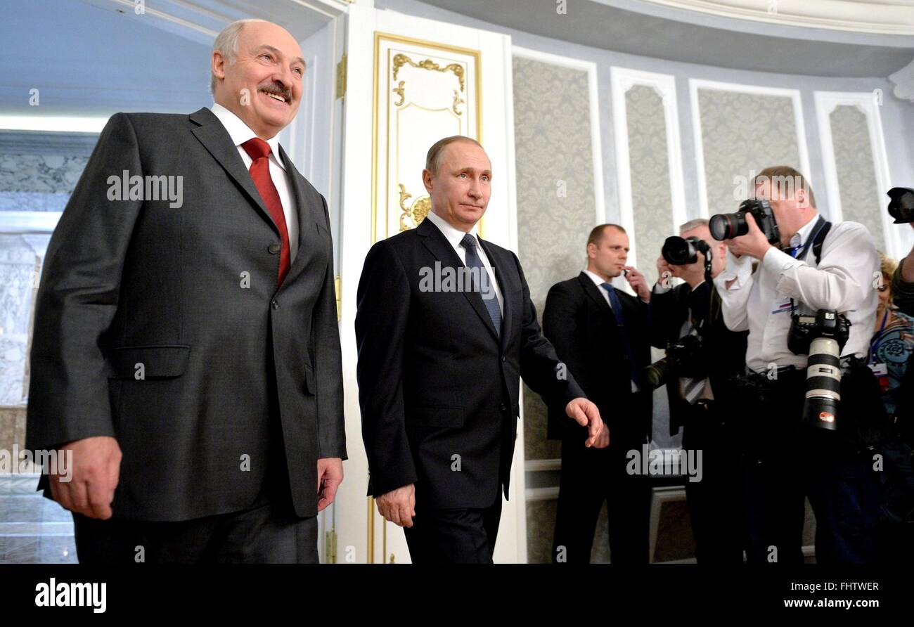 Russian President Vladimir Putin enters the room with Belarus President Alexander Lukashenko for a bilateral meeting at the Independence Palace February 25, 2016 in Minsk, Belarus. Lukashenko caused a stir on Russian social media when he confused Putin with Russian Prime Minister Dmitry Medvedev. Stock Photo