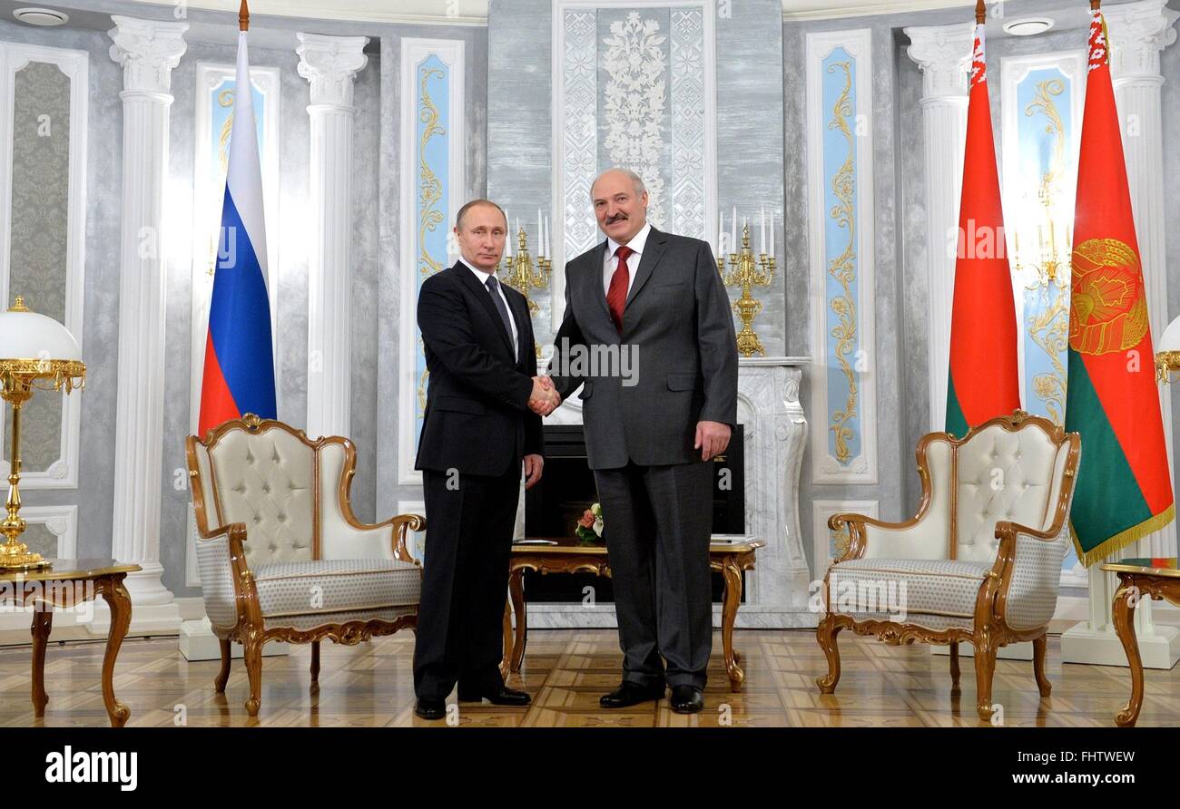 Russian President Vladimir Putin shakes hands with Belarus President Alexander Lukashenko before a bilateral meeting at the Independence Palace February 25, 2016 in Minsk, Belarus. Lukashenko caused a stir on Russian social media when he confused Putin with Russian Prime Minister Dmitry Medvedev. Stock Photo