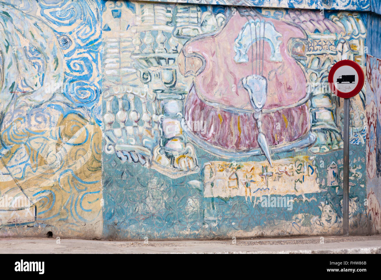 Truck lorry road traffic sign in front of street art mural murals on wall at Havana, Cuba, West Indies, Caribbean, Central America Stock Photo