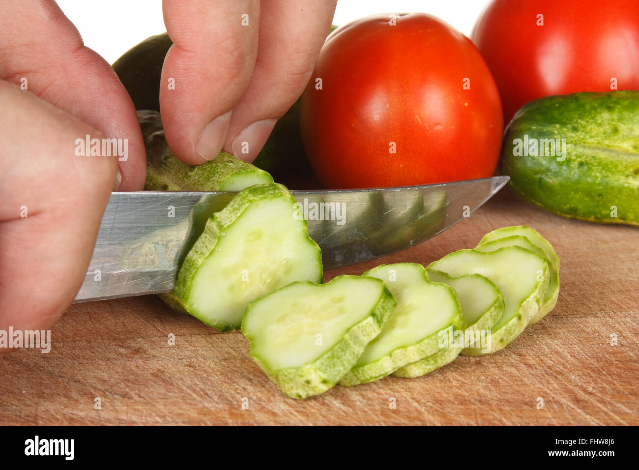 chop tomatoes and cucumbers Stock Photo Alamy