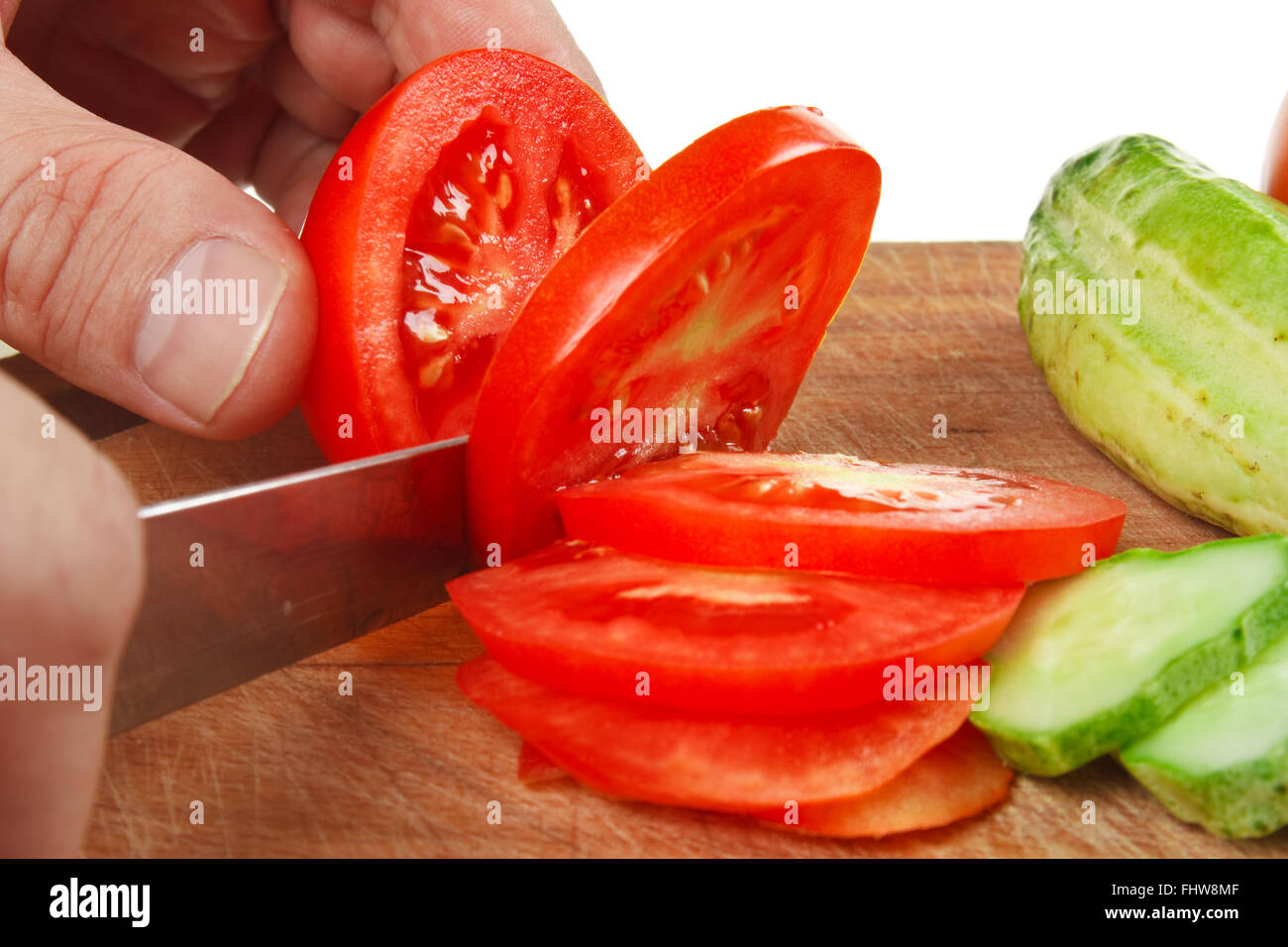 chop tomatoes and cucumbers Stock Photo Alamy