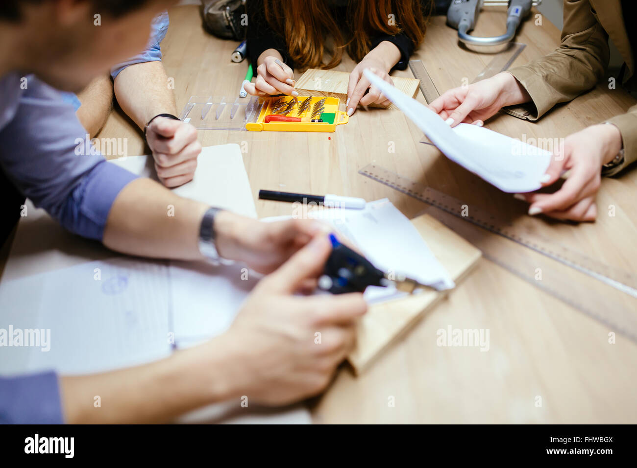 Group of designer working on project in workshop Stock Photo