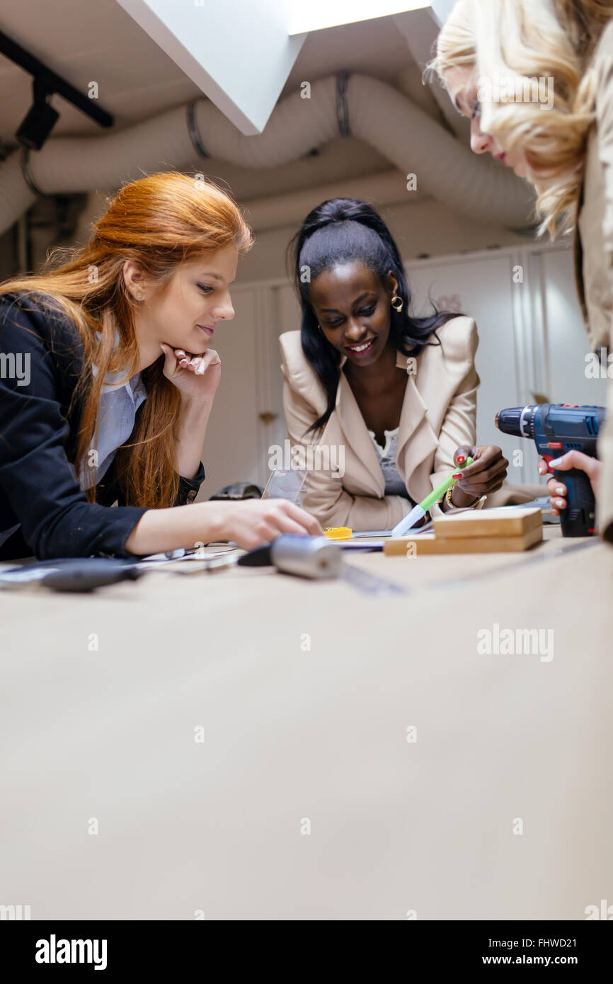 Creative women working on project and brainstorming in workshop Stock Photo