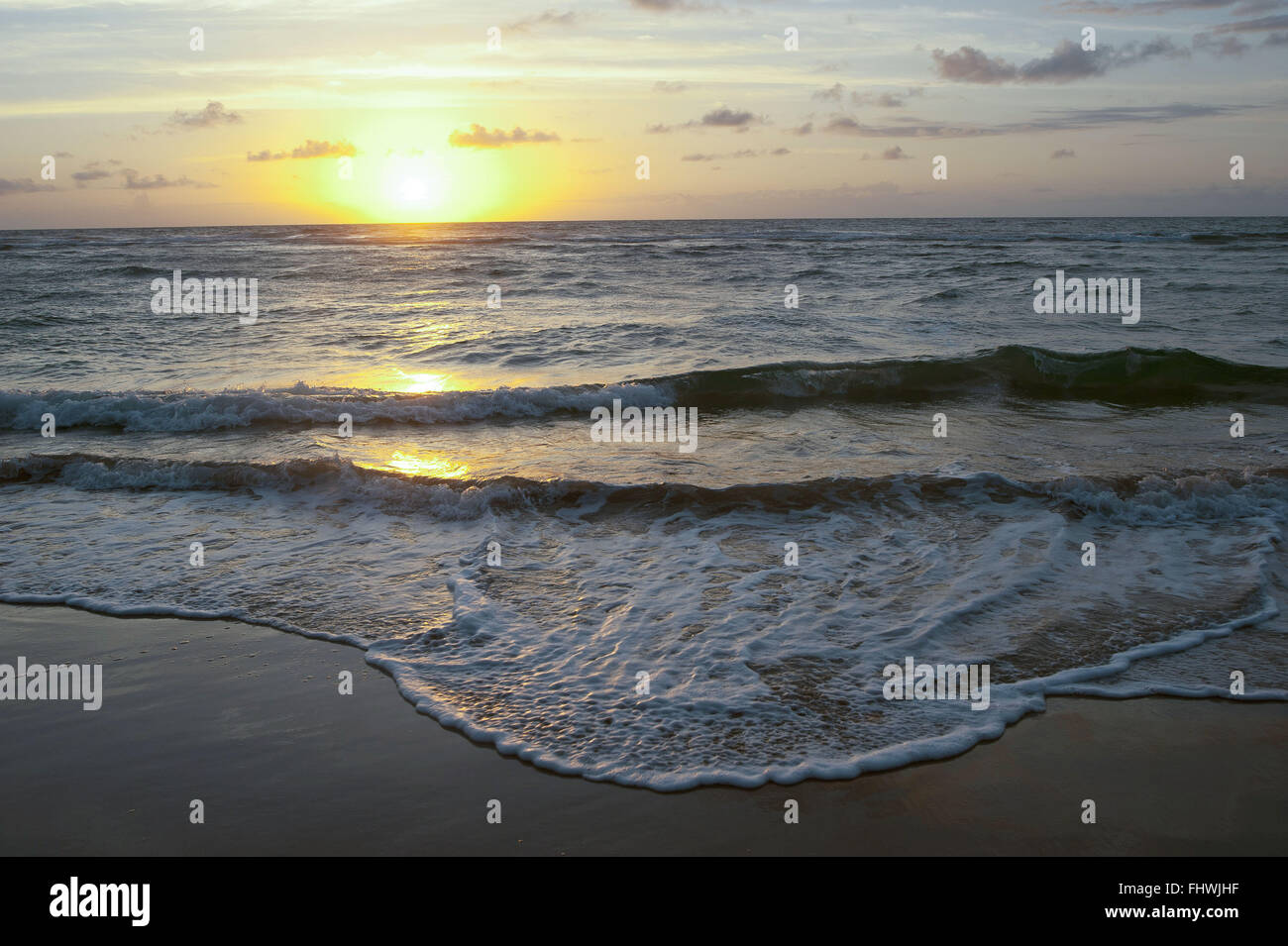 Sunrise at sea in Taipu de Fora Beach - Marau Peninsula - Costa do Dende Stock Photo