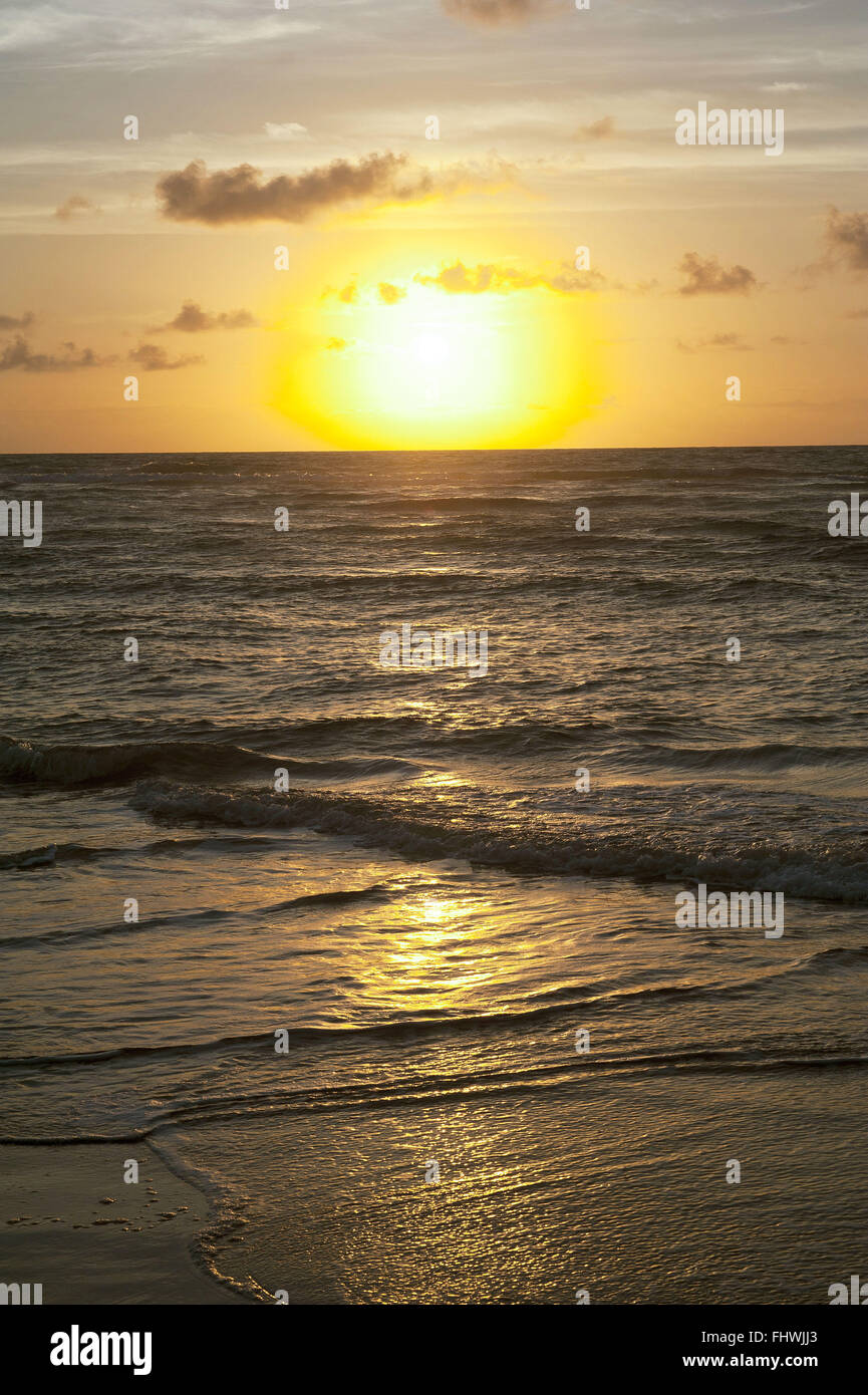 Sunrise at sea in Taipu de Fora Beach - Marau Peninsula - Costa do Dende Stock Photo