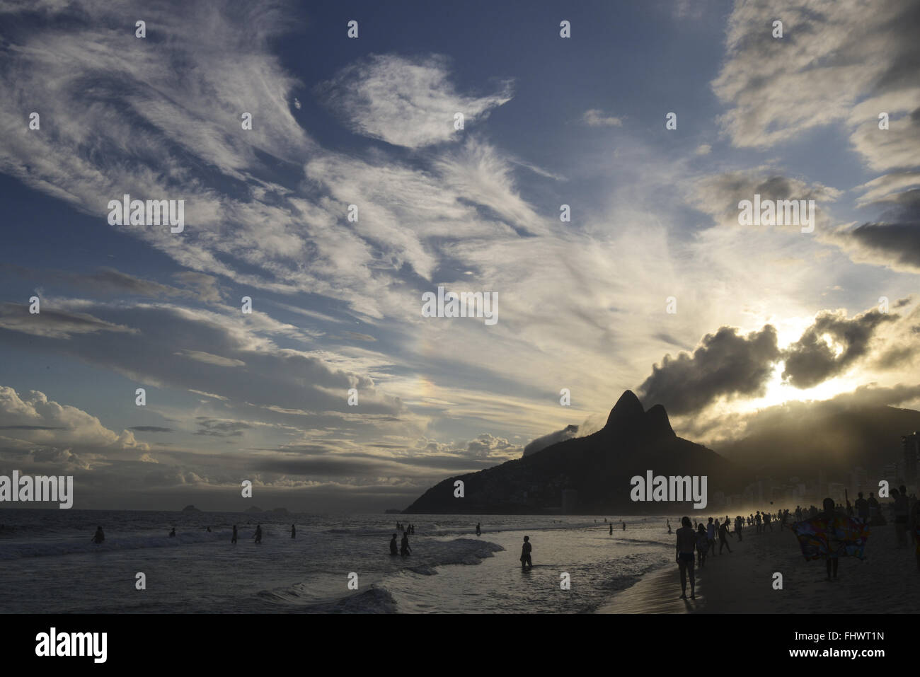 Sunset at Ipanema Beach with Dois Brothers Incidental Stock Photo