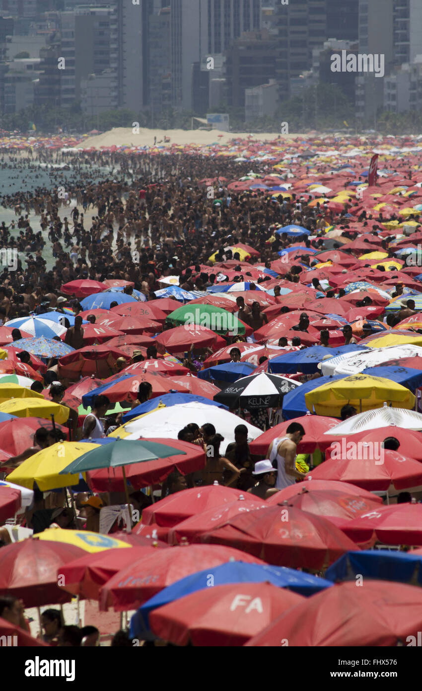 Umbrellas on crowded beach on the edge of Ipanema and Leblon - southern city Stock Photo