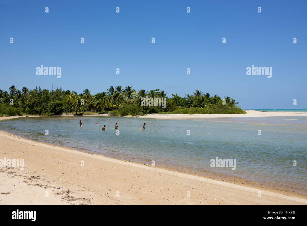 Maragogi swimmers crossing the river to the beach at low tide Camacho Stock Photo