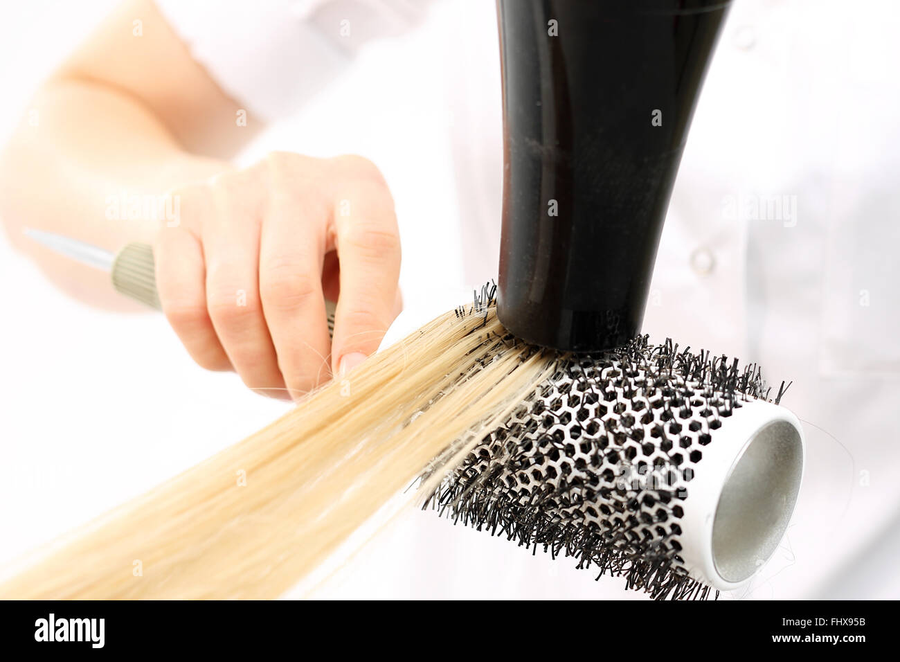 Hair blonde dryer round brush hi-res stock photography and images - Alamy