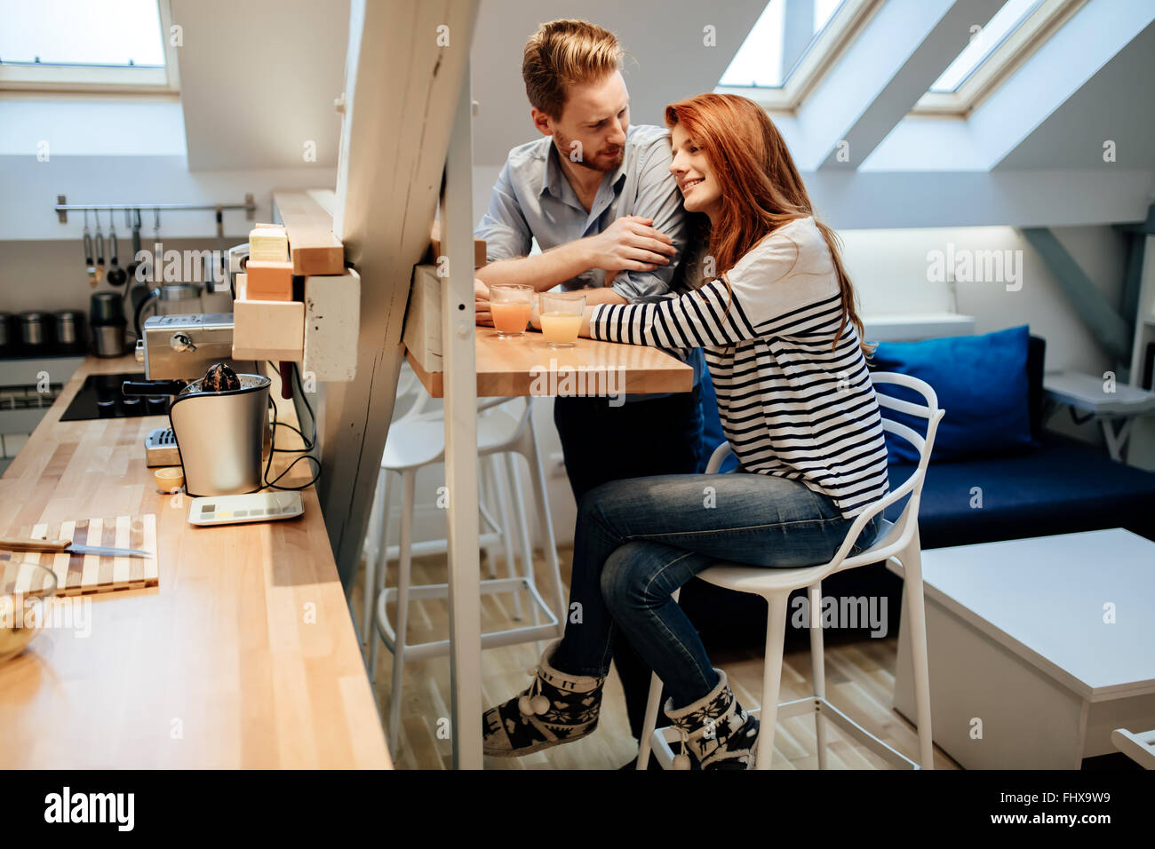 Couple in love talking smiling at home while being truly happy Stock ...