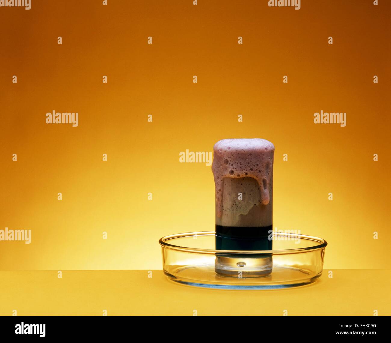 Two different liquids mixed together causing chemical reaction in glass