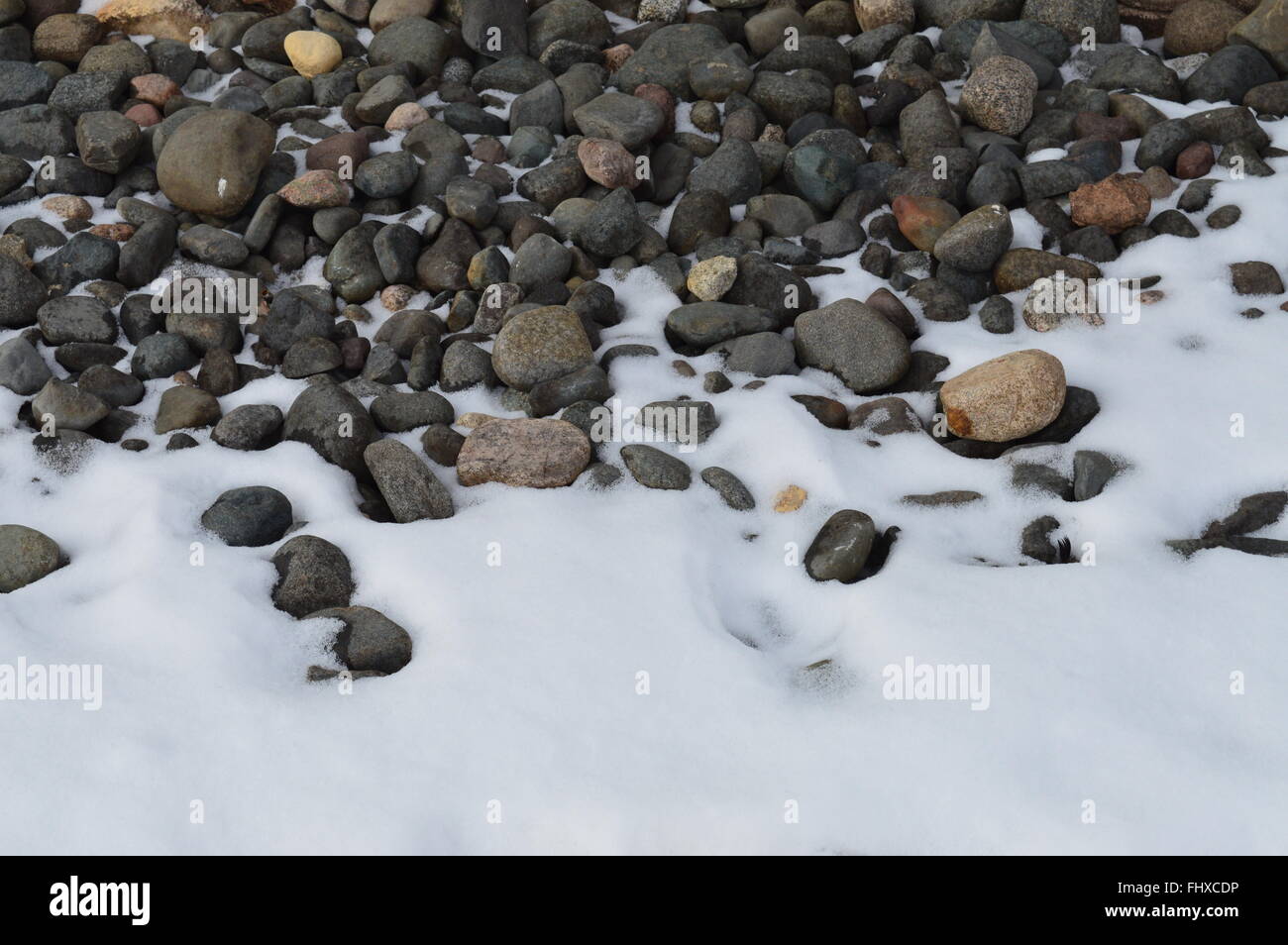 Rocks and snow background Stock Photo - Alamy