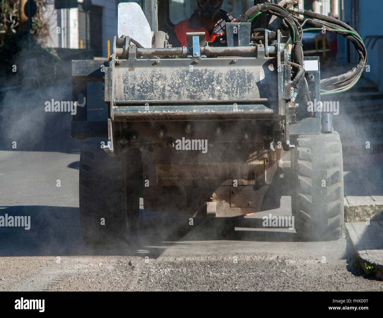 Milling of asphalt for road reconstruction accessory for skid steer