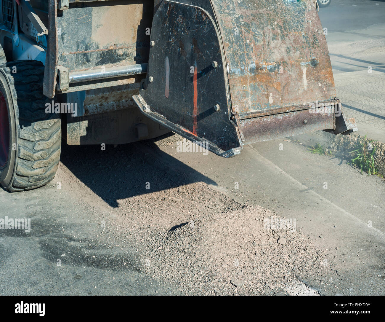 Milling of asphalt for road reconstruction accessory for skid steer