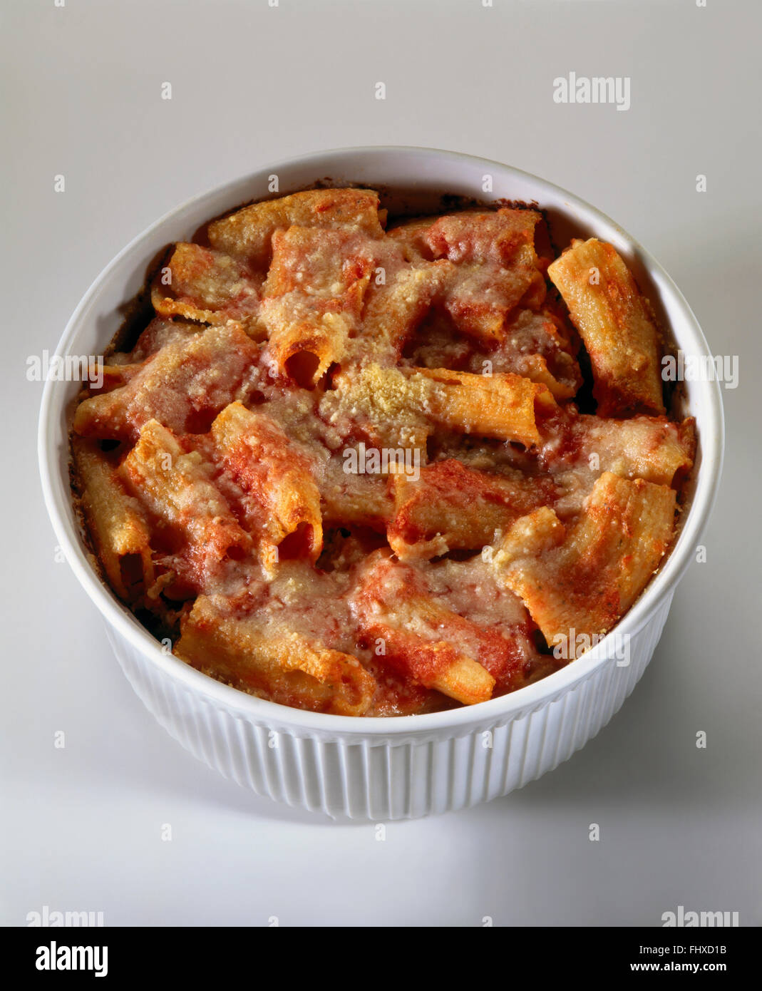 Rigatoni pasta with tomato sauce and cheese, baked in souffle dish