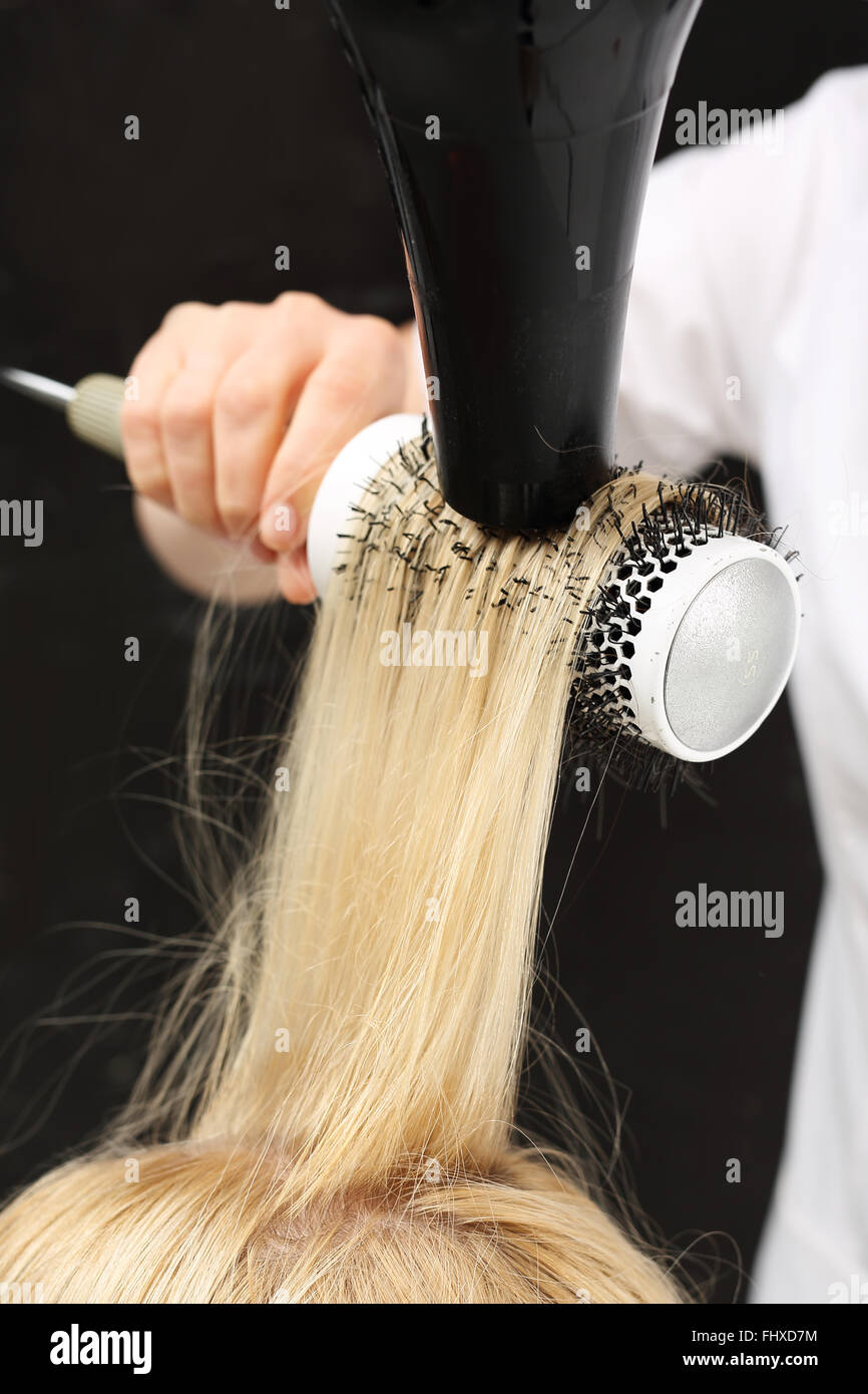 Hair blonde dryer round brush hi-res stock photography and images - Alamy