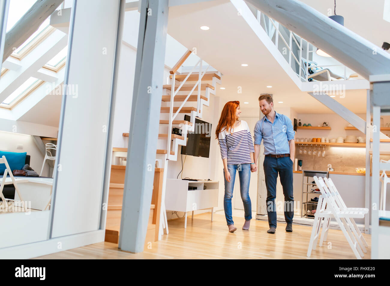 Couple moving in new apartment with smiles on their faces Stock Photo ...