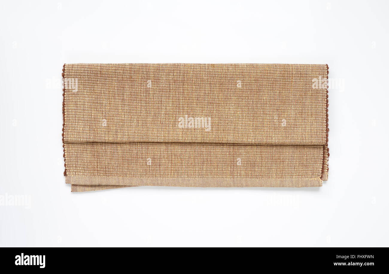 folded cotton yarn place mat on white background Stock Photo