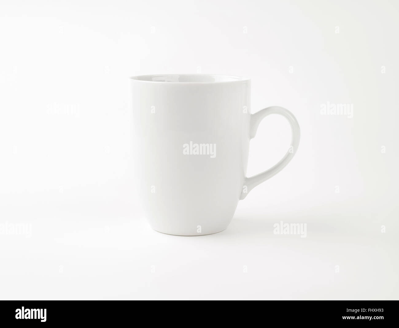 empty white mug on white background Stock Photo - Alamy