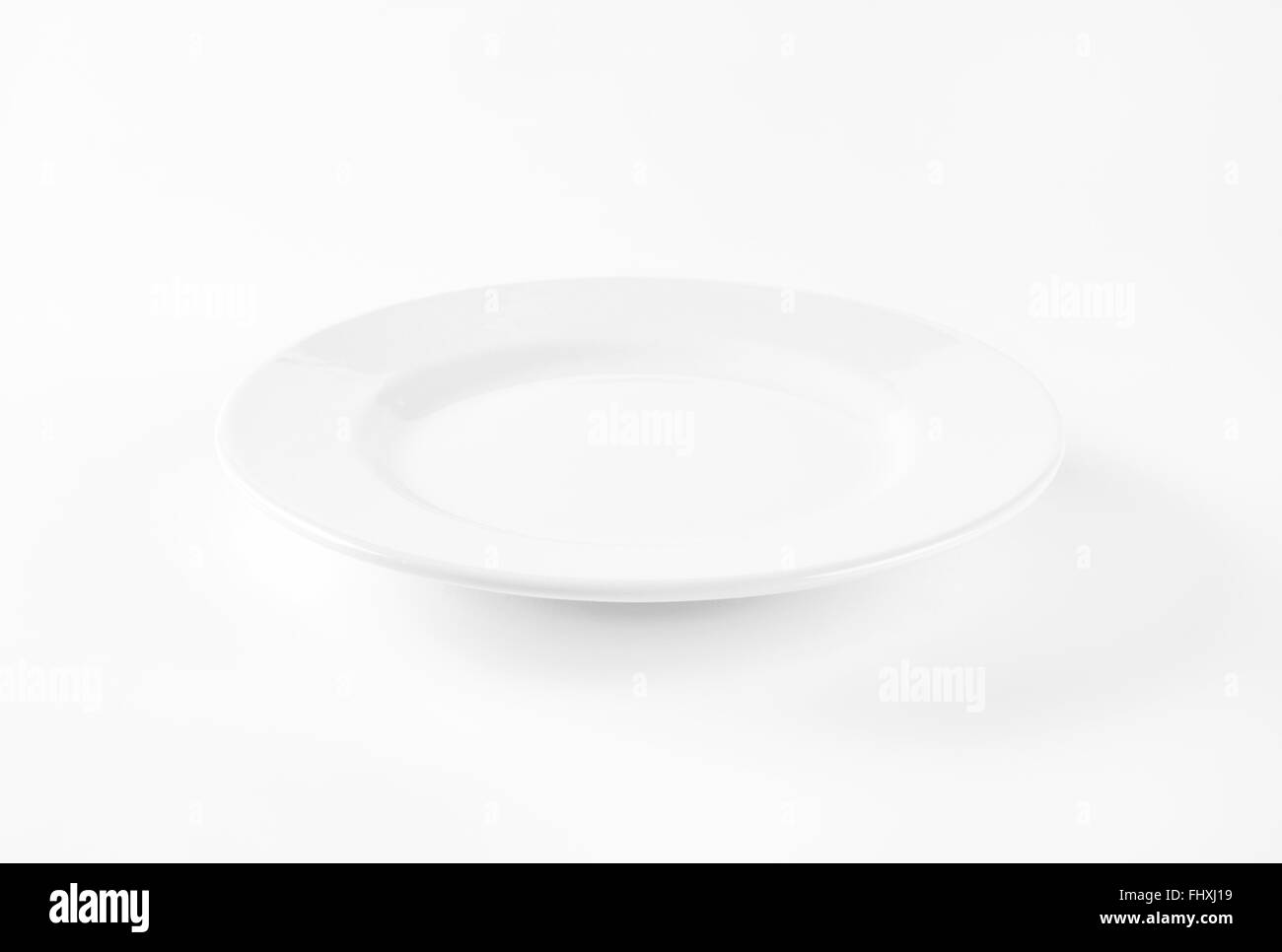 empty white plate on white background Stock Photo - Alamy