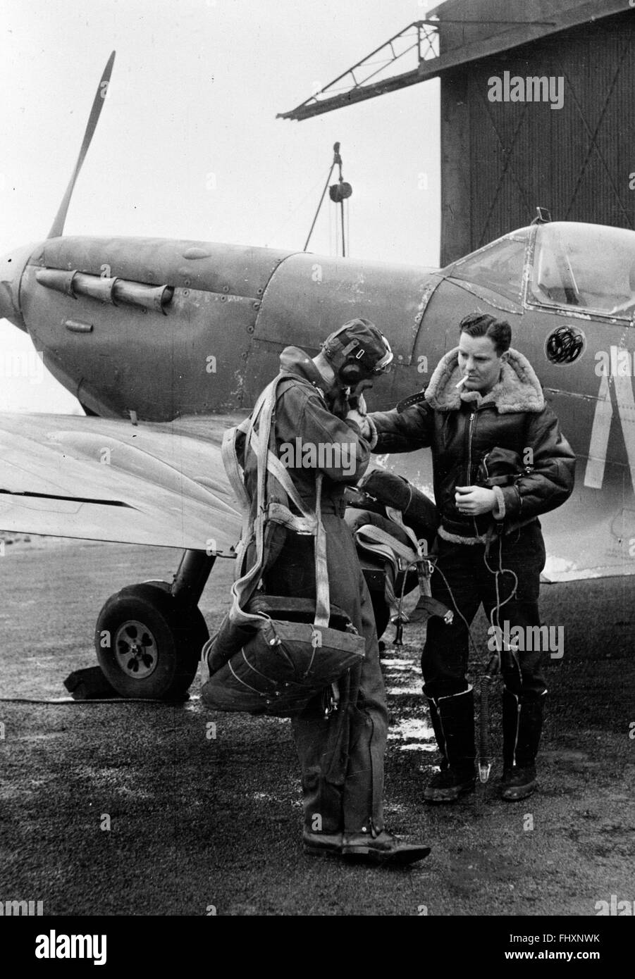 British Spitfire and pilots prepare for flight in 1943 Stock Photo