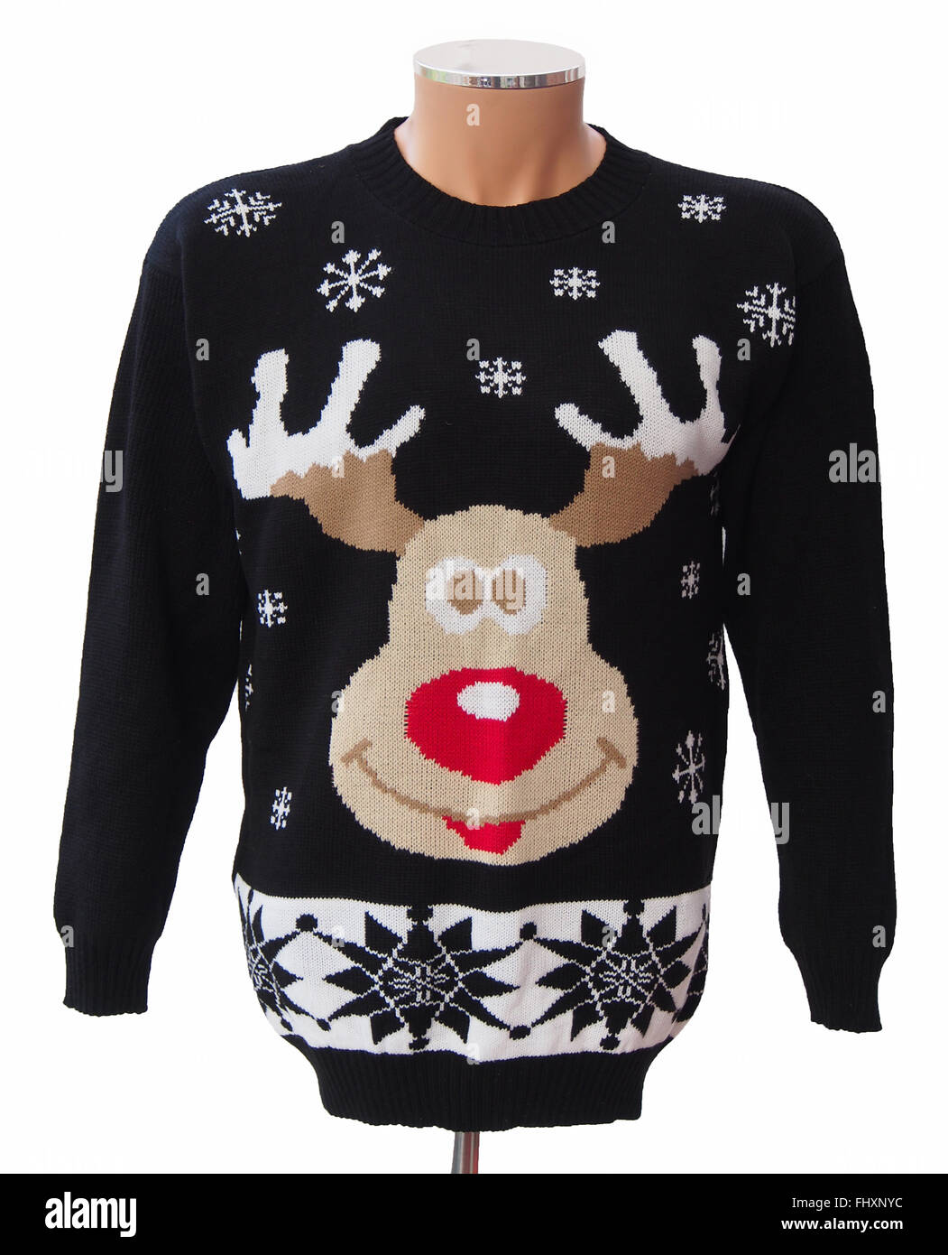 Black knitted adults' Christmas jumper, featuring Rudolph the red nosed reindeer and snowflakes, isolated on a white background. Stock Photo