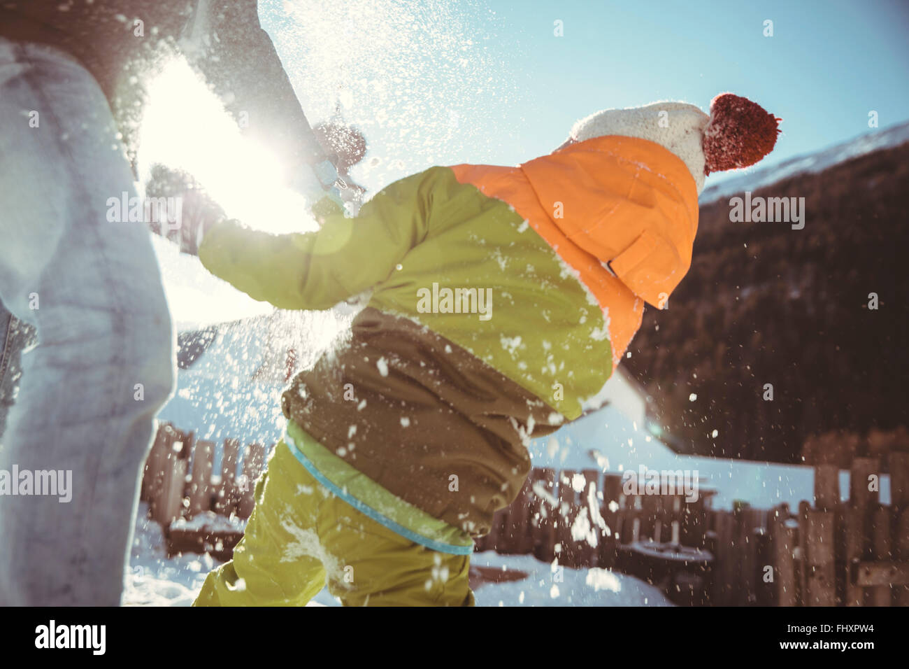 Italy, Val Venosta, Slingia, father and son having a snowball fight Stock Photo