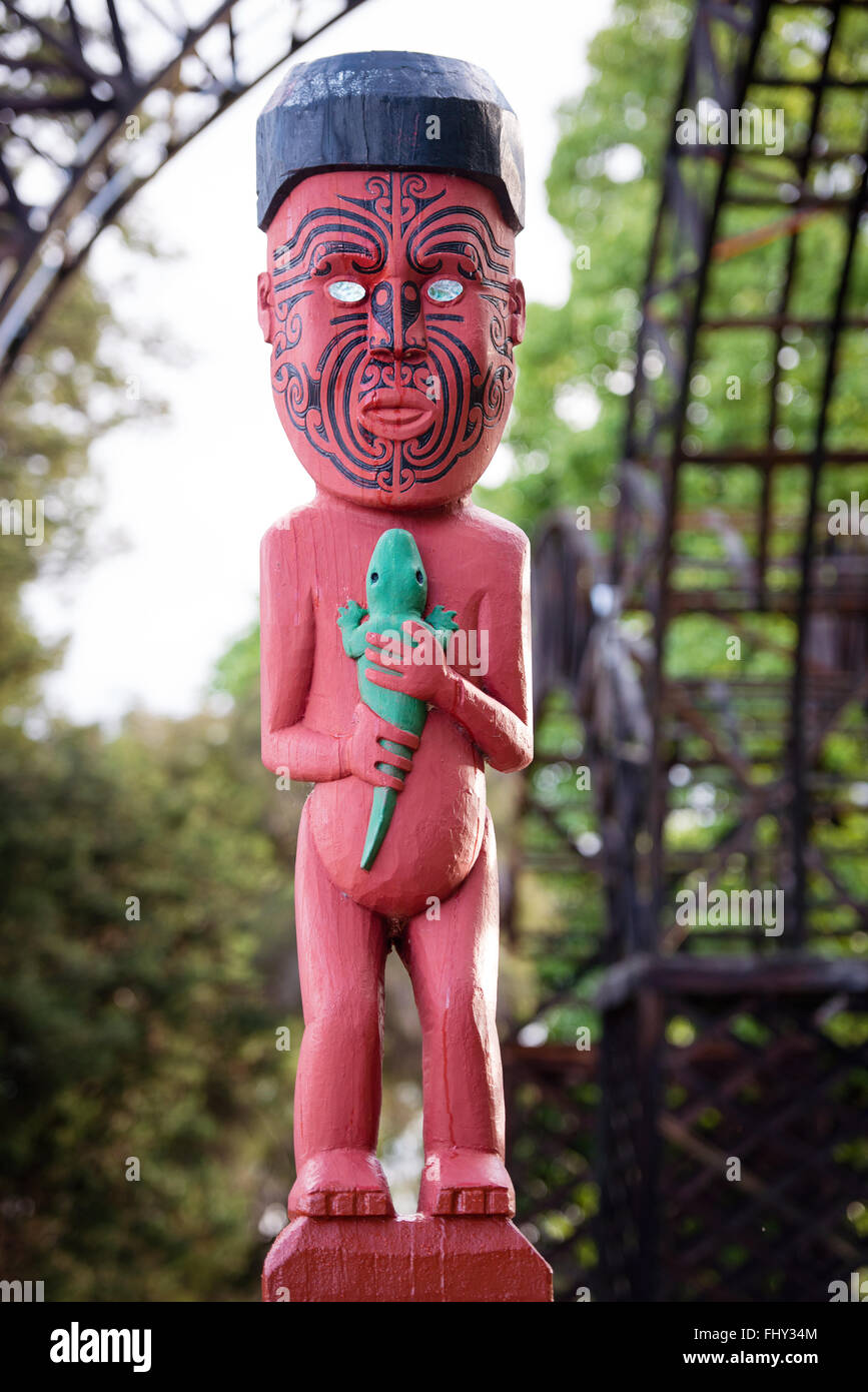 Traditional Maori carving sculpture of a man in Rotorua park, North Island, New Zealand Stock Photo